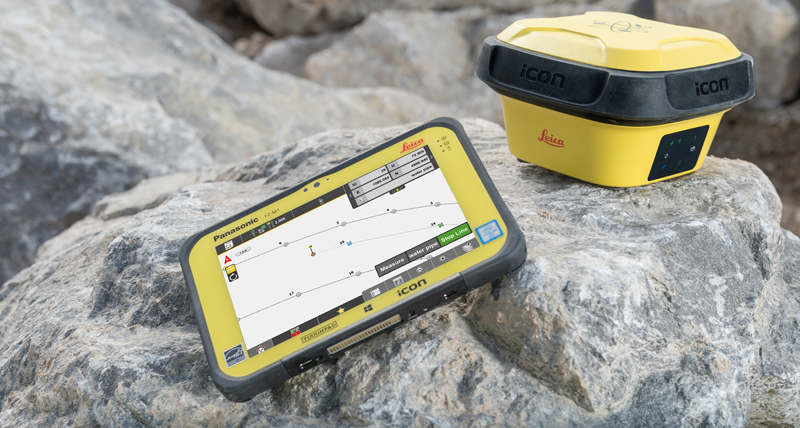 Odbiornik Leica iCON GPS 70 i kontroler terenowy Leica iCON CC80 z oprogramowaniem Leica iCON site leżące na skałach.